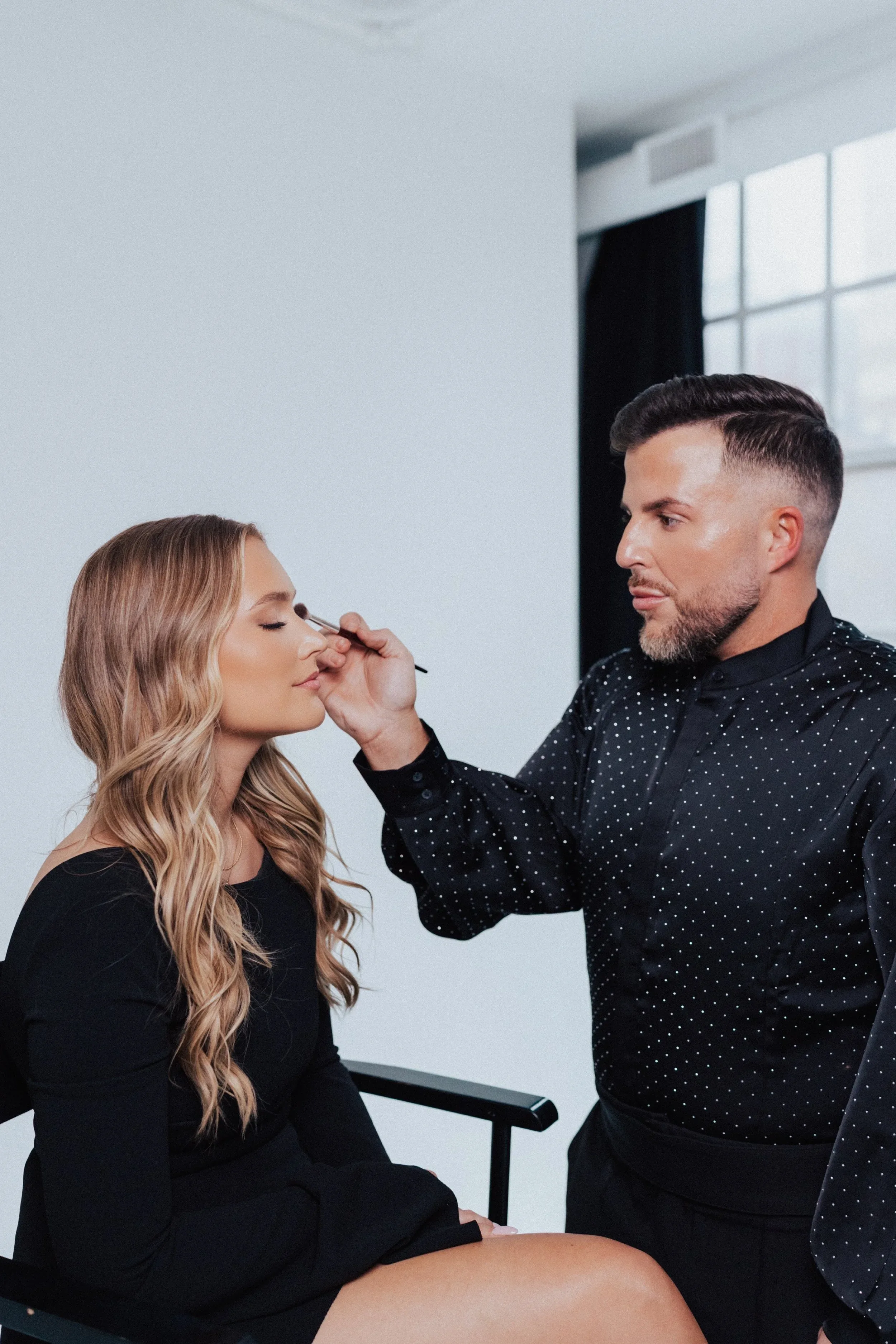 Beauty professional providing a makeup service